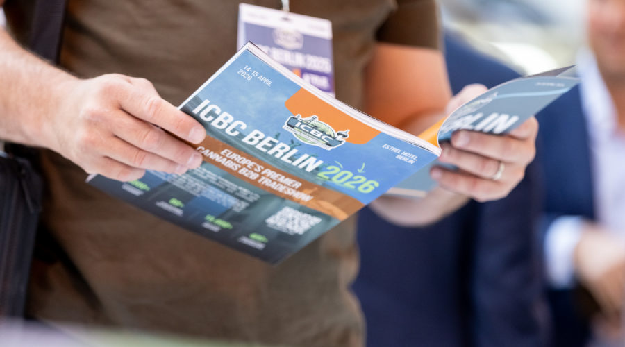 person holding icbc Berlin 2026 magazine
