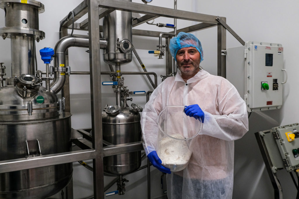 Men with isolate and lab machinery